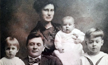 Studio portrait of Fred Pfeifer and Nellie (Logan) Pfeifer with children (from left) Charlotte, Eleanor, and Forest, taken around 1918